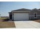 Charming single-Gathering home featuring a two-car garage and neutral color palette at 263 Warner Crossing Way, Loris, SC 29569