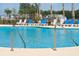 A refreshing pool with lounge chairs offers a relaxing outdoor retreat at 263 Warner Crossing Way, Loris, SC 29569
