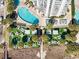 Aerial view of resort pool, lounge chairs, landscaping and white multi-story building at 2700 N Ocean Blvd. # 1053, Myrtle Beach, SC 29577