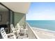 Relax on this condo balcony offering stunning ocean views and comfortable seating at 2700 N Ocean Blvd. # 1053, Myrtle Beach, SC 29577