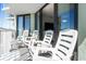 Relax on the spacious balcony with comfortable chairs and scenic views at 2700 N Ocean Blvd. # 1053, Myrtle Beach, SC 29577