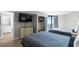 Comfortable bedroom with twin beds, a TV, and balcony access with ocean views at 2700 N Ocean Blvd. # 1053, Myrtle Beach, SC 29577
