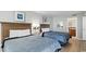 Bright and airy bedroom featuring two queen beds, a TV, and stylish décor at 2700 N Ocean Blvd. # 1053, Myrtle Beach, SC 29577