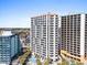 Exterior condo complex with a pristine pool, palm trees, and lounge chairs at 2700 N Ocean Blvd. # 1053, Myrtle Beach, SC 29577