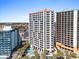 Exterior condo complex with a pristine pool, palm trees, and lounge chairs at 2700 N Ocean Blvd. # 1053, Myrtle Beach, SC 29577