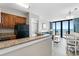 Modern kitchen with granite countertops, stainless steel appliances, and ocean views at 2700 N Ocean Blvd. # 1053, Myrtle Beach, SC 29577