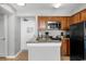 Well-equipped kitchen with granite countertops and stainless steel microwave at 2700 N Ocean Blvd. # 1053, Myrtle Beach, SC 29577