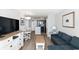 Cozy living room with modern decor, leading into an open kitchen and dining area at 2700 N Ocean Blvd. # 1053, Myrtle Beach, SC 29577