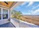 Scenic view from a back porch overlooking a marsh landscape on a sunny day at 3 Half Shell Ct., Pawleys Island, SC 29585