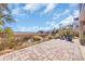 Expansive backyard featuring a stone patio and fire pit, backing up to a scenic marsh landscape at 3 Half Shell Ct., Pawleys Island, SC 29585