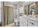 Well-lit bathroom featuring a shower-tub combo with modern vanity, and a framed mirror at 3 Half Shell Ct., Pawleys Island, SC 29585