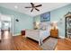 Charming bedroom features a ceiling fan, stylish decor, and a comfortable bed with accent pillows at 3 Half Shell Ct., Pawleys Island, SC 29585
