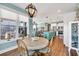 Inviting dining area with wood table, view to the kitchen and outdoor deck at 3 Half Shell Ct., Pawleys Island, SC 29585