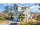 Charming three-story beach house with a two-car garage and marsh views, surrounded by lush greenery at 3 Half Shell Ct., Pawleys Island, SC 29585