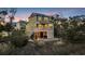 Stunning home exterior at twilight with a fire pit and marsh views, blending luxury with nature at 3 Half Shell Ct., Pawleys Island, SC 29585