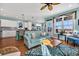 Cozy living room open to the kitchen, featuring coastal decor and lots of natural light at 3 Half Shell Ct., Pawleys Island, SC 29585