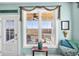 View from a Beach House window onto a patio, chairs, and expansive field at 3 Half Shell Ct., Pawleys Island, SC 29585