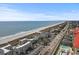 Coastal aerial view of condo buildings along a beach with neighborhood and partial view of outdoor pool at 300 Shorehaven Dr. # W-3, North Myrtle Beach, SC 29582