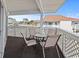 Charming balcony with a table and chairs perfect for outdoor dining and relaxation at 300 Shorehaven Dr. # W-3, North Myrtle Beach, SC 29582