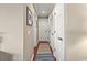 Inviting hallway featuring wood floors and crisp white doors leading to various rooms in the home at 300 Shorehaven Dr. # W-3, North Myrtle Beach, SC 29582