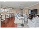Cozy living room features hardwood floors, neutral tones, ceiling fan, and comfortable seating at 300 Shorehaven Dr. # W-3, North Myrtle Beach, SC 29582