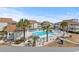 Condo pool surrounded by palm trees and landscaping creates a relaxing outdoor space at 300 Shorehaven Dr. # W-3, North Myrtle Beach, SC 29582