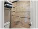 Detailed view of the walk-in shower with built-in shelving and modern fixtures, offering convenience at 300 Shorehaven Dr. # W-3, North Myrtle Beach, SC 29582