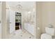 Well-lit bathroom boasts double sinks, marble floors, modern fixtures, and access to bedroom and shower at 3120 Bayhaven Dr., Myrtle Beach, SC 29579