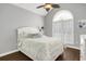 Bedroom with bed and bedside table in front of large bright window with shutters at 3120 Bayhaven Dr., Myrtle Beach, SC 29579