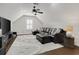 Upstairs bonus room featuring a large sectional, tv, and hardwood floors at 3120 Bayhaven Dr., Myrtle Beach, SC 29579