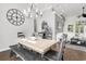 Bright dining area featuring a stylish chandelier and an oversized decorative clock at 3120 Bayhaven Dr., Myrtle Beach, SC 29579