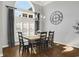Dining room features a table with seating for six underneath a modern chandelier at 3120 Bayhaven Dr., Myrtle Beach, SC 29579