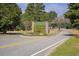 Community entrance sign with brick pillars, landscaping, and yellow striped road at 3120 Bayhaven Dr., Myrtle Beach, SC 29579