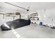Spacious garage with storage shelving and car cover at 3120 Bayhaven Dr., Myrtle Beach, SC 29579