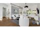 Bright living room features hardwood floors, a ceiling fan, and comfortable white furniture at 3120 Bayhaven Dr., Myrtle Beach, SC 29579