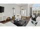 Bright living room boasts high ceilings, dark wood floors, and neutral decor at 3120 Bayhaven Dr., Myrtle Beach, SC 29579