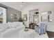 Bright and spacious, the living room is well-lit with large windows and tasteful decor at 3120 Bayhaven Dr., Myrtle Beach, SC 29579