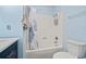 Bright bathroom showcasing a tub-shower combination with a curtain, a toilet, and a vanity at 310 5Th Ave. N # 206, Surfside Beach, SC 29575