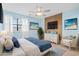 Stylishly staged bedroom with coastal decor and soft blue accents, virtually staged at 310 5Th Ave. N # 206, Surfside Beach, SC 29575