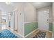 Inviting entryway with wood floors, stylish rugs, and green accents at 310 5Th Ave. N # 206, Surfside Beach, SC 29575