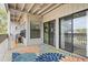 Charming patio with colorful rug and sliding glass doors to the interior at 310 5Th Ave. N # 206, Surfside Beach, SC 29575