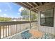 Covered patio with a decorative outdoor rug and beautiful views of the surrounding neighborhood at 310 5Th Ave. N # 206, Surfside Beach, SC 29575