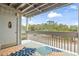 Inviting patio with a decorative rug and view of mature trees at 310 5Th Ave. N # 206, Surfside Beach, SC 29575