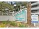 Sea Grove at Surfside signage, with bright yellow flowers at 310 5Th Ave. N # 206, Surfside Beach, SC 29575