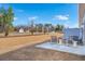 A backyard with a concrete patio, outdoor seating, and view of the community entrance at 312 Brackish Dr. # 312, Myrtle Beach, SC 29588
