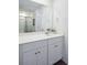 Bathroom vanity with white countertop, double sinks, and view of tub-shower combo with curtain at 312 Brackish Dr. # 312, Myrtle Beach, SC 29588