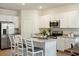 Bright kitchen with white cabinets, stainless steel appliances, granite countertops, and island at 312 Brackish Dr. # 312, Myrtle Beach, SC 29588