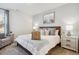 Relaxing bedroom with wood-framed bed, ocean-themed art, decorative pillows, and coordinating bedside tables at 316 Brackish Dr. # 316, Myrtle Beach, SC 29588