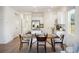 Open-concept kitchen and dining area features a stylish table setting and modern appliances at 316 Brackish Dr. # 316, Myrtle Beach, SC 29588