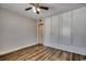 Bedroom with wood-look floors, ceiling fan, and white built in storage at 3555 Highway 544 # 4-C, Conway, SC 29526